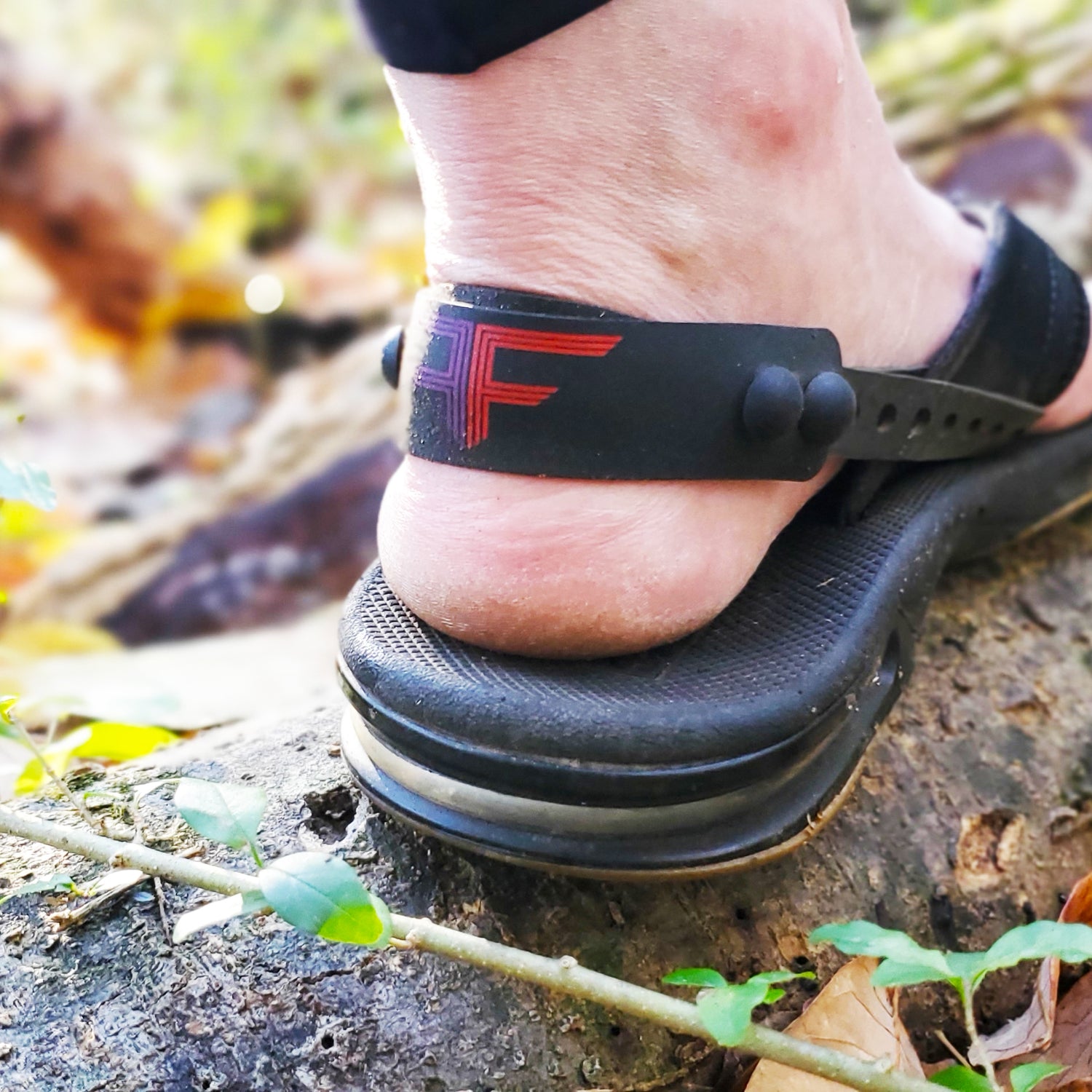 Stepping on log while hiking, wearing the patented Flip Flap. Security never felt so good.